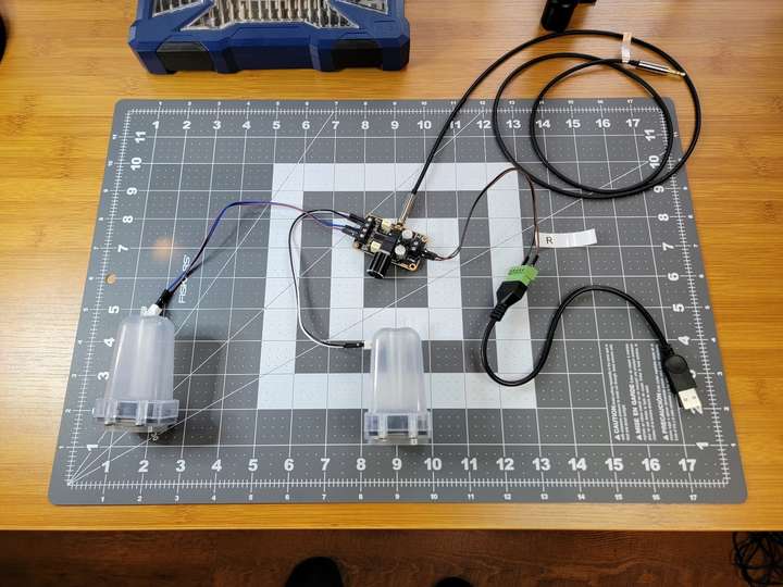 The amp wired to a set of iMac speakers