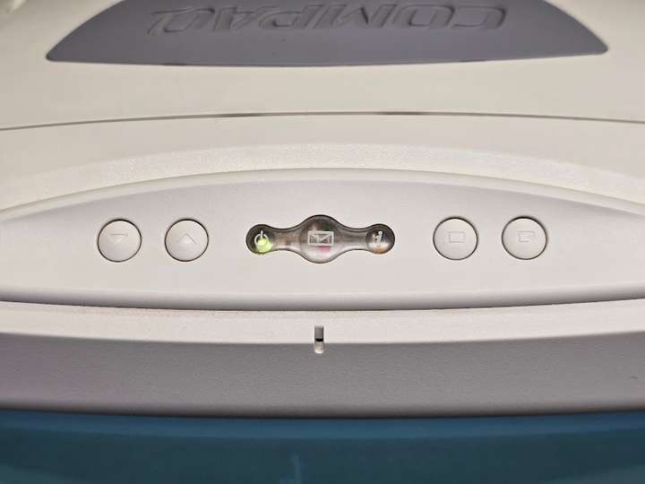 Microphone, volume, and OSD controls above monitor